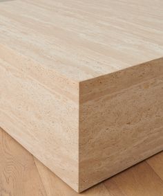 a wooden box sitting on top of a hard wood floor