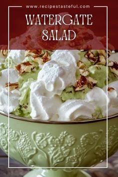 a green bowl filled with whipped cream and other toppings on top of a wooden table