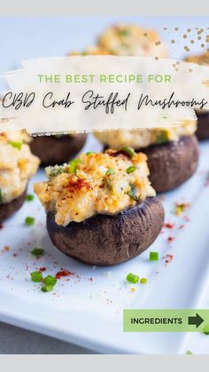 stuffed mushrooms topped with cheese and green onions on a white plate, ready to be eaten