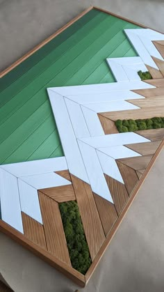 a wooden table with moss growing on it's sides and an upside down view of the top