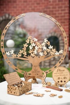 a wooden tree on top of a white table