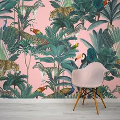 a wallpapered room with pink and green tropical leaves, leopards and other animals