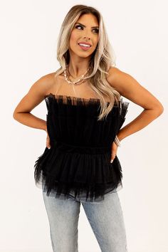 – This top will have you feeling fun and fabulous – Lightweight ruffled tulle material with a full soft lining – Slightly stretchy waistband – Hidden side zip with a hook and eye closure – Flattering silhouette that falls into a straight peplum hemline Measurements S : Bust 32", Hip 32", Length 33", Waist 28". M : Bust 34", Hip 34", Length 34", Waist 30". L : Bust 36", Hip 36", Length 36", Waist 32". Fitted Tulle Top For Party, Chic Fitted Tulle Top, Tulle Top With Ruffles For Party, Party Tops With Ruffles And Tulle Material, Chic Tulle Top With Ruffles, Chic Tulle Tops With Ruffles, Flirty Black Ruffled Top, Black Flirty Top With Ruffles, Flirty Black Top With Ruffles