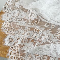 an image of white lace on wooden table