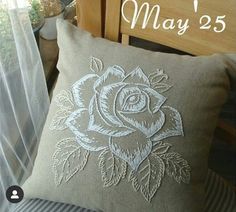 a close up of a pillow on a bed