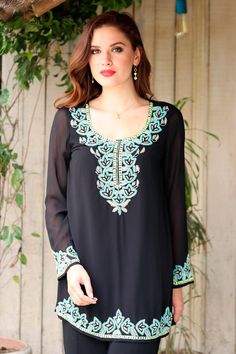 Walk out the door in beaded splendor with this beautiful tunic, designed and crafted by India's Sandip Agarwal. The sheer black top is adorned with intricate hand beading along the neckline, hem and sleeves. The blouse is lined, its long sheer sleeves allow for ease of movement, while the beadwork sparkles in the light. Black Sheer Top, Women Encouragement, Rayon Dress, Walk Out, Design Patterns, Casual Skirt, Mens Accessories Fashion, Long Sleeve Tunic, Sheer Sleeves