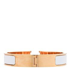 This is an authentic HERMES Enamel Narrow Clic Clac H Bracelet PM in White. This chic bracelet has a gold plated band with a white enamel inlay and an "H" swivel closure. H Bracelet, Chic Bracelet, White Enamel, Gold Plate, Plating, Band, Bracelet, Gold, White