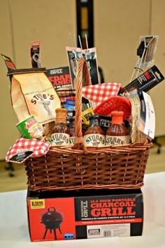 a basket filled with barbecue related items on top of a table