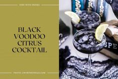 black voodoo citrus cocktail in glasses with lemon wedges on the rim and books behind it