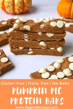 gluten - free pumpkin pie protein bars with white chocolate chips are stacked on top of each other