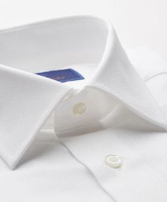 Tailored in crisp, long-staple cotton, a handsomely textured dress shirt is topped with a broad spread collar and finished with a clean French placket and rich French cuffs. Removable collar stays French placket Back yoke Curved hem 100% cotton Machine wash, line dry Sizes: 14.5 thru 18.5 Machine Washable Striped Shirts, Collar Stays, Trim Fit, Custom Suit, Oxford Dress, Fitted Dress Shirts, Men Shirt, White Shirt Dress, Fit Dress