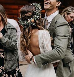 a man in a suit and tie dancing with his bride on the dancefloor