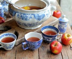 tea and apples on a wooden table