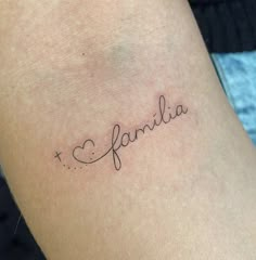 a tattoo that reads i love family on the side of a woman's arm