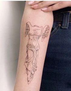 a woman's arm with an angel tattoo on the left side of her arm