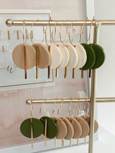 a rack with earrings hanging from it's sides