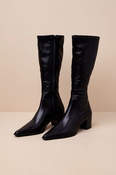 The Vagabond Giselle Black Leather Pointed-Toe Knee-High Boots will easily become your go-to footwear this season! Luxe genuine leather shapes a pointed-toe upper with a seamed vamp that rises to a flexible, 14"" knee-high shaft with a 14.5"" circumference. An 8"" zipper at the instep allows for easy on-and-off, all atop a sleek block heel. Available in Euro sizes only. 2" block heel. Cushioned insole. Rubber sole has nonskid markings. Genuine leather upper. Balance man made materials. Imported. Pointed Toe Knee-high Boots With Reinforced Heel Medium Width, Pointed Toe Knee-high Boots With Reinforced Heel, Fitted Leather Knee-high Boots With Pointed Toe, Leather Knee-high Boots With Snip Toe For Spring, Sleek Leather Knee-high Boots With Almond Toe, Sleek Pointed Toe Knee-high Boots, Sleek Knee-high Boots With Pointed Toe, Knee-high Boots With Padded Heel And Pointed Toe, Leather Knee-high Boots With Stacked Heel And Snip Toe