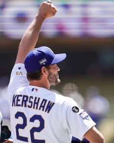 a baseball player with his arm in the air