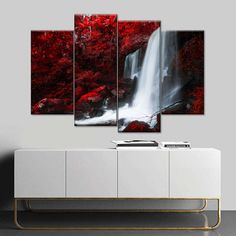 a waterfall surrounded by red trees in the middle of a wall mounted canvas art print