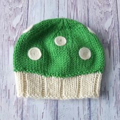 "A perfect little mushroom cap! Our bestselling baby beanie. Handknit in a soft and cozy, 100% wool, this original and very sweet little hat will keep baby heads warm in style. The ribbed hem will gently hug little ears as the adorable mushroom cap slouches in the back. The dots have been thoughtfully needle-felted in place. Colours are perfect for the holiday season. Colour Options: Red and Cream Red, White and Tan Pink and Cream - sold out / available soon Green and Cream Newborn Circumference Playful Warm Bonnet Cap, Warm Cute Bonnet, One Size Fits Most, Cute One Size Beanie, Playful Beanie Cap One Size Fits Most, Playful Beanie Bonnet, Warm Playful Cap Beanie, Playful Knitted Bonnet, One Size, Cute Warm Yarn Beanie, Knitted Mini Beanie Hat