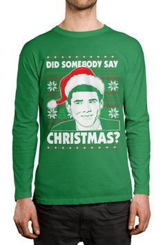 a man wearing a green christmas sweater with the words did somebody say christmas? on it