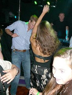 a group of people dancing at a party