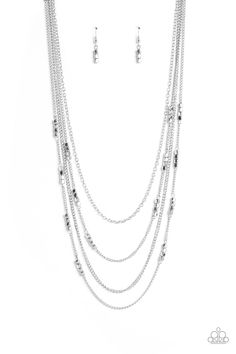 Glistening silver chains, sporadically infused with a quartet of silver beads link into fashionable layers below the neckline for a monochromatic medley. Features an adjustable clasp closure.   Sold as one individual necklace. Includes one pair of matching earrings. Silver Multi-strand Layered Necklace With Beaded Chain, Silver Multi-strand Necklace With Satellite Chain, Silver Beaded Chain Layered Necklace, Silver Layered Beaded Chain Necklace, Silver Multi-strand Satellite Chain Jewelry, Adjustable Silver Satellite Chain Necklace, Party Necklaces With Silver Satellite Chain, Silver Necklaces With Satellite Chain For Parties, Detailed Butterfly