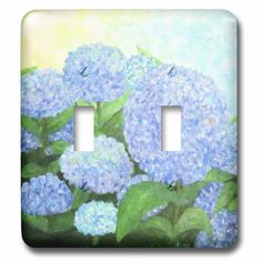 two light switch plates with blue flowers painted on the front and back covers in pastel colors