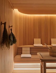 a wooden sauna with benches and towels on it