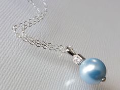 Wedding Light Blue Blush Blue Pearl Drop .925 Sterling Silver CZ Bridal Pendant Necklace with .925 Sterling Silver Chain. PLEASE READ ITEM DESCRIPTION and SHOP POLICIES before placing your order, and contact me with any questions! CHAIN is 18 inches (45.7cm) long. PENDANT is about 0.70 inch (1.8cm) long including bail. BRIDAL NECKLACES SECTION: https://www.etsy.com/shop/LanaChayka?ref=seller-platform-mcnav§ion_id=11638944 JEWELRY SETS SECTION: https://www.etsy.com/shop/LanaChayka?ref=seller-plat Elegant Light Blue Necklace For Anniversary, Blue Pearl Pendant Jewelry For Wedding, Formal Blue Necklace With Pearl Pendant, Formal Blue Pearl Pendant Jewelry, Formal Blue Jewelry With Pearl Pendant, Elegant Light Blue Necklace For Wedding, Elegant Light Blue Wedding Necklaces, Elegant Light Blue Jewelry For Wedding, Elegant Blue Wedding Necklaces