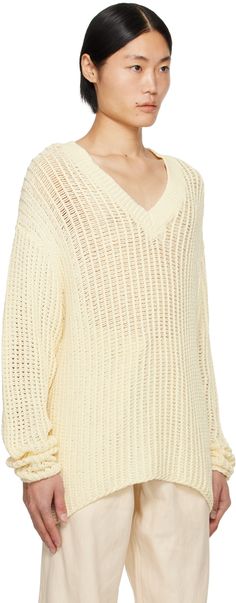 Knit cotton sweater. · Rib knit V-neck · Dropped shoulders Supplier color: Off-white White Knitted V-neck Sweater For Spring, Cream Textured Knit V-neck Sweater, Cream Knitted V-neck Sweater, Cream V-neck Knitted Sweater, White Knit V-neck Sweater, White V-neck Knit Sweater, Cream Cotton V-neck Sweater, White V-neck Sweater For Spring, Cotton V-neck Sweater With Pointelle Knit