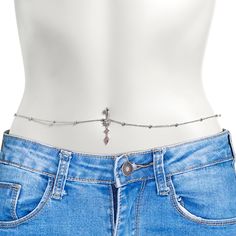 the back of a woman's jeans with a chain belt and cross on it