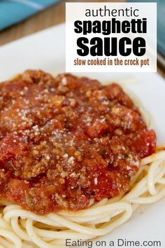 spaghetti sauce is cooked in the crock pot and served on a plate with text reading authentic spaghetti sauce slow cooked in the crock pot eating on a dime com