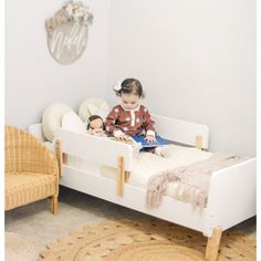 "A sturdy bed built just for toddlers with playful curves and modern shapes to smooth the meaningful transition into “a real bed.” The low profile and two removable rails provide a safe and comfortable sleeping place that helps your active toddler easily get in and out of bed. This high-quality bed fits a standard crib mattress and brightens any decor with a pop of modern design. " dadada Bed Frame Color: White/Natural | dadada Muse 19.49 H x 31.0 W x 55.0 D in white / brown in White / Natural | Modern Toddler Bed, Nursing Pillows, Toddler Beds, Modern Shapes, High Quality Bedding, Crib Mattress, Toddler Room, Quality Bedding, White Bedding