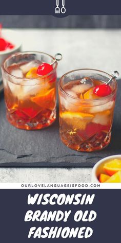 two glasses filled with drinks sitting on top of a table