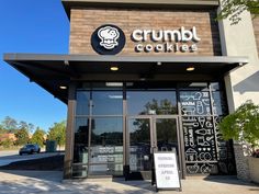 the front entrance to a restaurant called crumb cookies