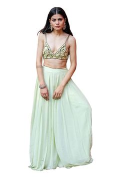 Mint green bralette with mirror embroidery in geometric pattern. Paired with a mint green flared pleated pant. - Aza Fashions Summer Party Georgette Sets, Pista Green Summer Party Sets, Summer Party Sets In Pista Green, Green Palazzo Set For Summer Festive Occasions, Summer Festive Green Palazzo Set, Summer Festive Green Sharara, Glamorous Festive Green Sets, Green Sharara For Spring Party, Elegant Green Lehenga For Summer