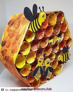 a bunch of cups that have been made to look like bees and honeybees