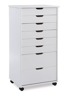 a white dresser with five drawers on wheels