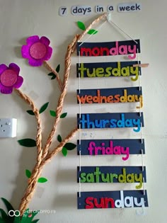 a bulletin board with flowers on it and the words monday, wednesday, friday, saturday