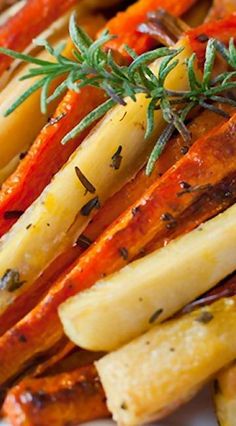 roasted carrots with herbs and rosemary on top