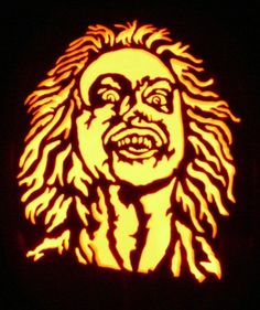 a carved pumpkin with an image of bob marley on it