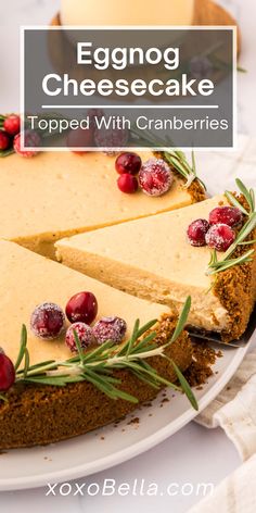 an eggnog cheesecake topped with cranberries on a white platter