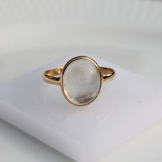 > Material - 18K Solid Yellow Gold > Gemstone - Rainbow moonstone > Gemstone Shape - Oval > Stone weight -6.30 ct > Gross weight - 2.7 grams > Number of stone - 1 piece This piece is made to order. Due to this, it takes 3 to 5 business days after your payment clears to complete your order. Please let me know if you have any questions about this product. These lovely crystals come in variety of colors, with the moonstone colors ranging from the milky white stones, to yellow, pea Minimalist Gold Moonstone Ring, Everyday Oval Moonstone Ring, Minimalist Oval Opal Ring In 14k Gold, Minimalist 14k Gold Oval Opal Ring, Yellow Gold Oval Moonstone Ring, Modern Oval Moonstone Ring In Yellow Gold, Delicate Oval Moonstone Ring In 14k Gold, Timeless Gold Oval Moonstone Ring, Modern Oval Yellow Gold Moonstone Ring