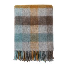 a brown and blue plaid blanket on a white background