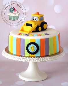 a birthday cake with a yellow tractor on top