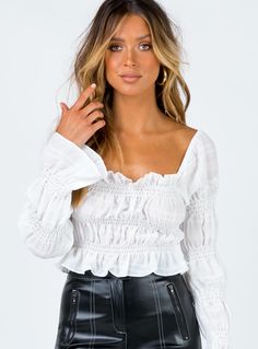 Chic White Smocked Top For Fall, Trendy Off-shoulder Top With Ruffles And Long Sleeves, Chic White Off-shoulder Top For Night Out, White Off-shoulder Top For Party, White Ruffled Off-shoulder Top For Day Out, Flirty Off-shoulder Tops For Brunch, White Off-shoulder Top With Ruffles For Day Out, White Smocked Top For Fall, White Smocked Top For Fall Day Out