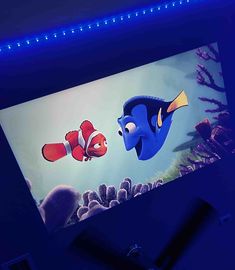 an animated character is on the screen in front of some corals and other fish