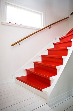 the stairs are painted bright red and white