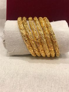 Christmas Gift, Holiday Gift,  24k gold plated Bangles, Indian Bridal Bangles, Handmade Bracelet for Women Gold Bangles for Women - Indian Bridal Bangles - Handmade Bracelet These stylish bangles feature a classic bangle design and are available in gold color. Material: High quality 24k gold plated bangles ( Not solid gold) Diameter: 2.48inches Can open Lead & Nickel free Tarnish resistant Hypoallergenic Gold Bracelets With Intricate Design For Diwali, 22k Gold Bangle For Festive Occasions, Festive Gold Round Bracelets, Festive Round Gold-plated Bracelet, Gold Bracelets For Diwali, Gold Bracelet With Intricate Design For Festive Occasions, Gold Bangle For Ceremonial Diwali, Gold Plated Bangle For Puja, Gold Plated Temple Jewelry Bracelets For Puja